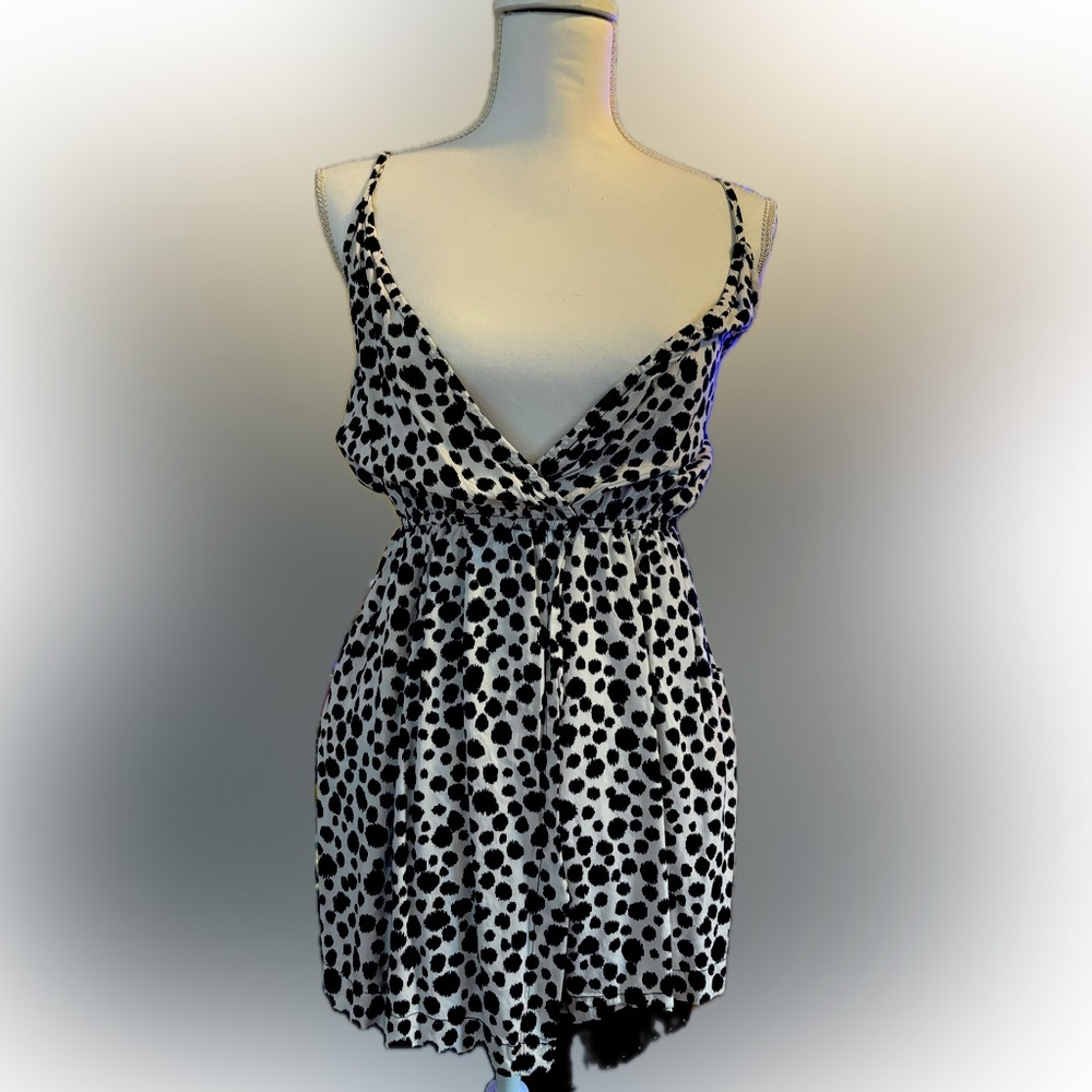 Very cute black and white spotted Millau romper with elastic waist size medium